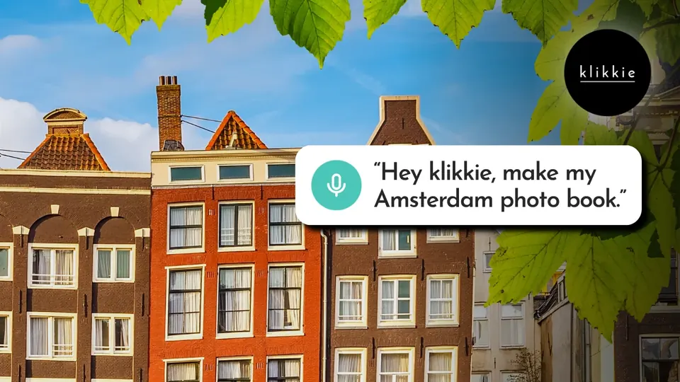 Amsterdam canal houses with the words “Hey klikkie, make my Amsterdam photo book.”